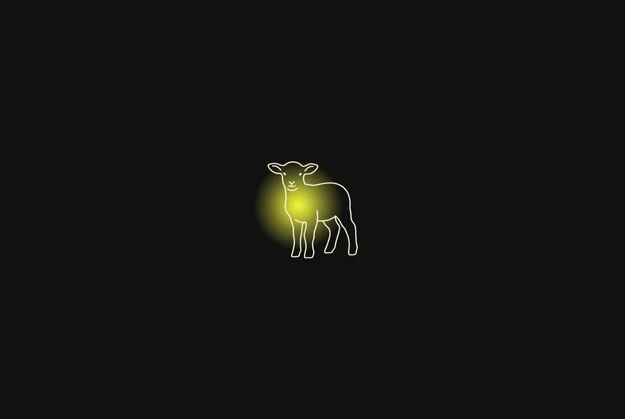 Line illustration: the outline of a small lamb standing alone, a soft acid yellow glow in its chest.
