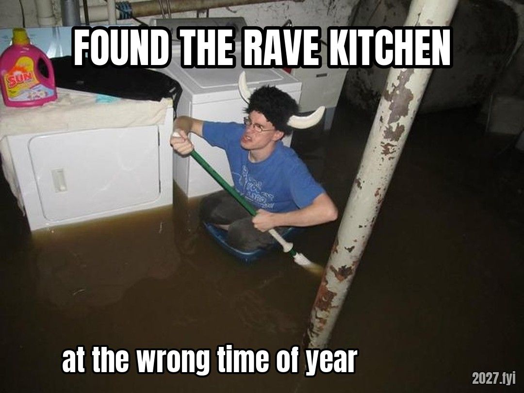 A man in a horned helmet wading through a flooded basement. FOUND THE RAVE KITCHEN / at the wrong time of year