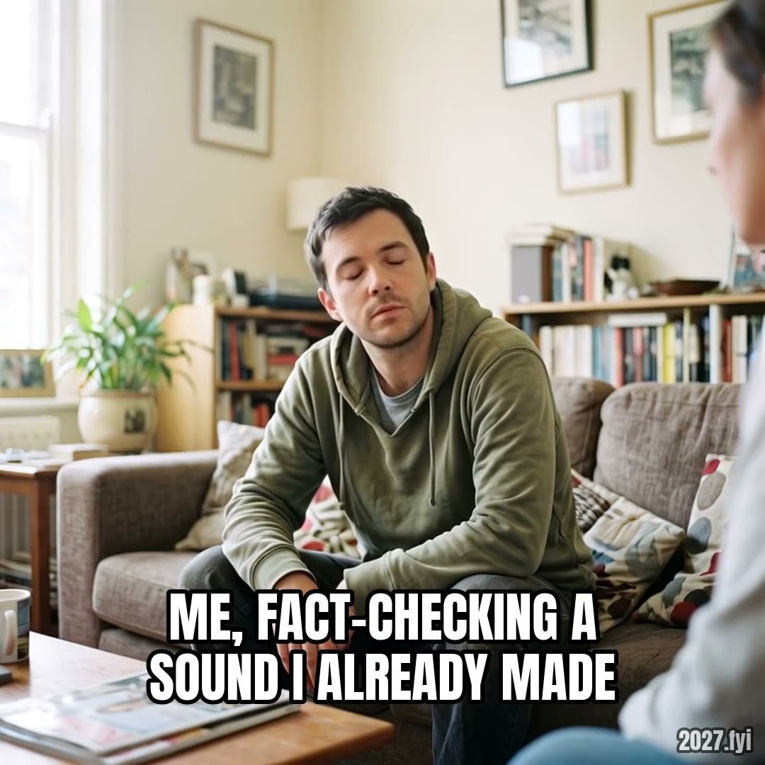 A man on a living-room sofa is asked a question, answers with a slow closed-mouth nod, then presses his lips together sceptically. Label: ME, FACT-CHECKING A SOUND I ALREADY MADE