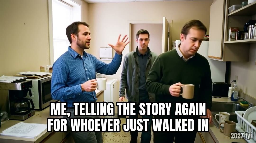 In an office kitchen a man keeps telling the same story with big gestures while colleagues come and go. Label: ME, TELLING THE STORY AGAIN FOR WHOEVER JUST WALKED IN